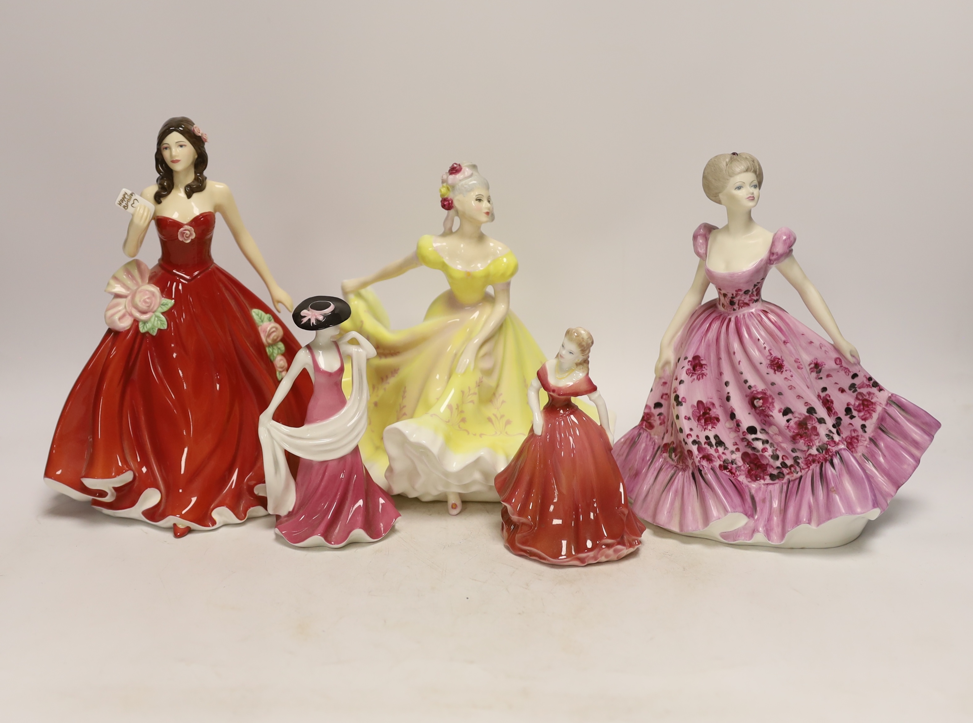 Three Coalport figurines and two Royal Doulton similar figurines